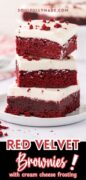 3 stacked red velvet brownies with cream cheese frosting are featured on a plate.