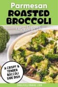 A white serving bowl is in a partial view filled with parmesan broccoli and garnished with a lemon wedge.