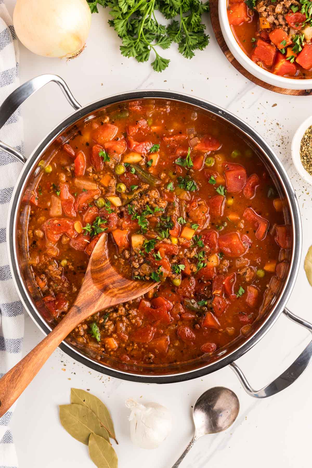 A large pot of vegetable soup made with hamburger.