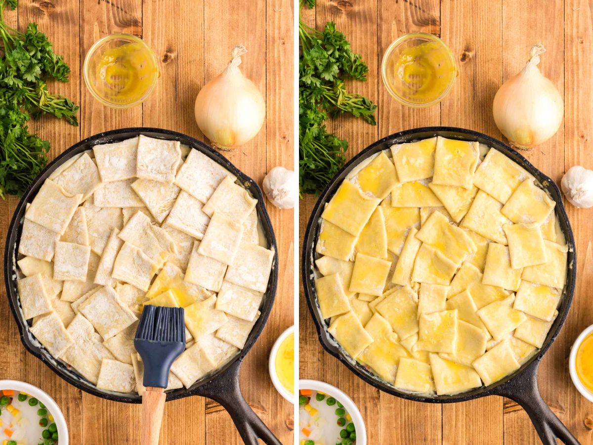 Brushing an egg wash over the puff pastry squares in a cast-iron skillet.