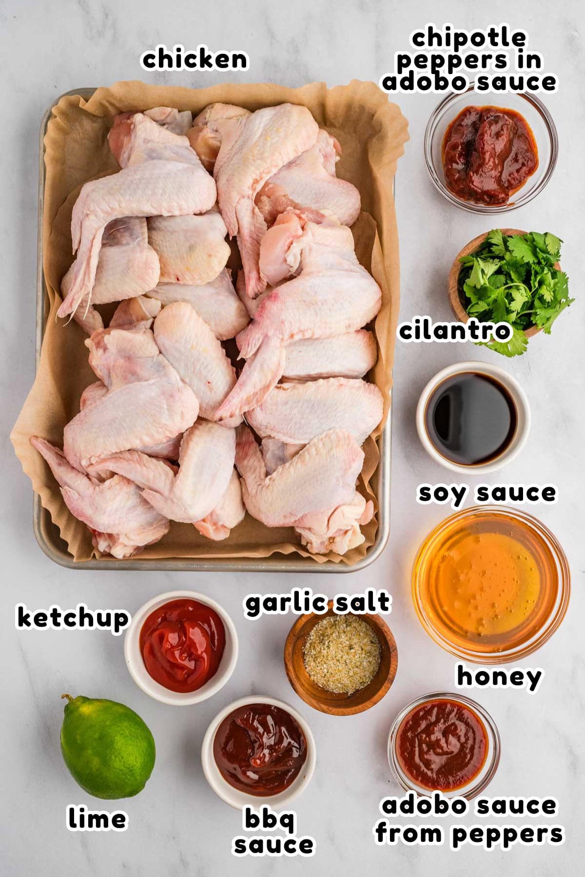 A labeled image of ingredients needed for honey chipotle barbecue chicken wings.