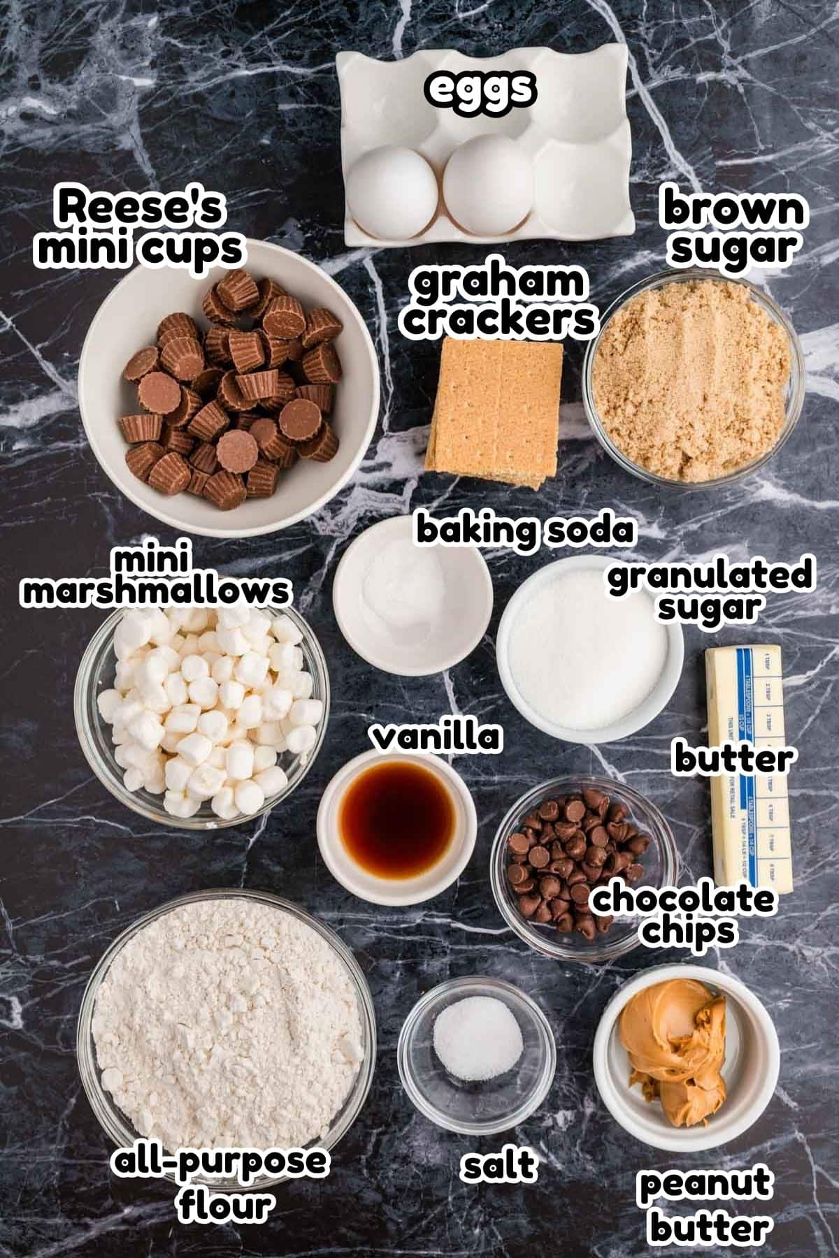 A labeled ingredient image of what is needed to make peanut butter s'mores cookies.