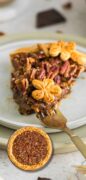 This is an image only pin for chocolate pecan pie featuring a slice of the pie and and imposed whole pie at the bottom.