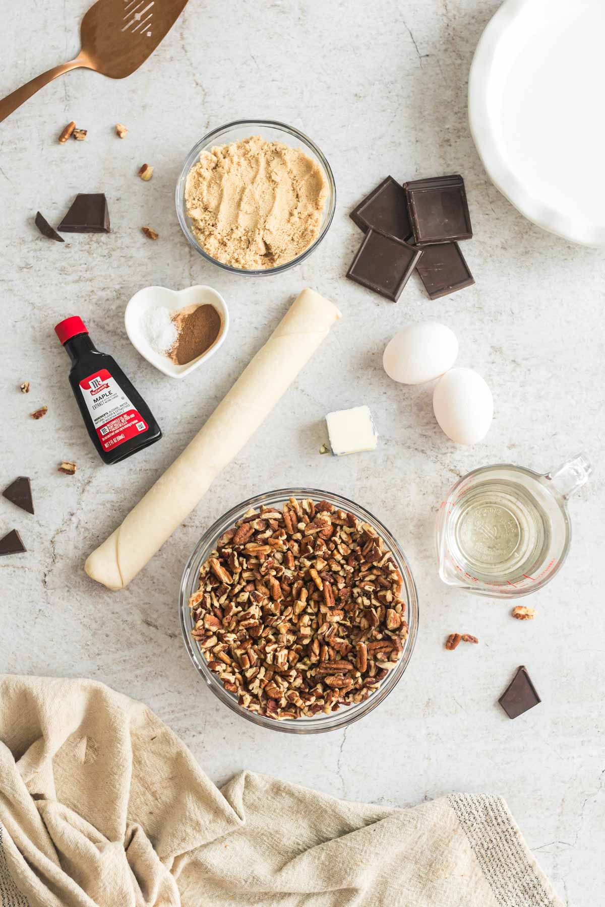 ingredients needed for a maple pecan pie with chocolate.