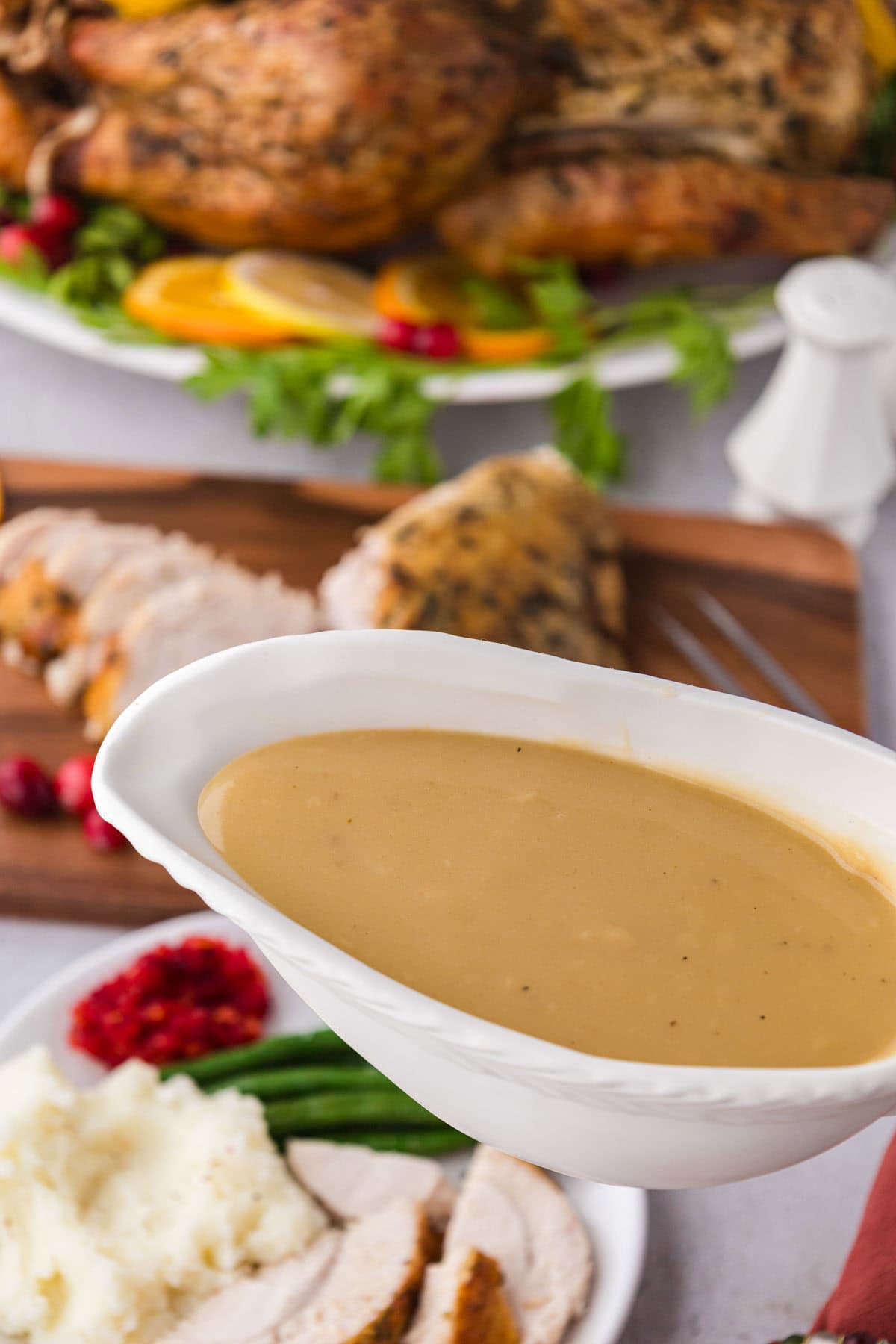 Turkey gravy in a white gravy boat