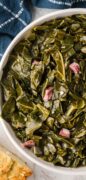 Collard greens in a white bowl.