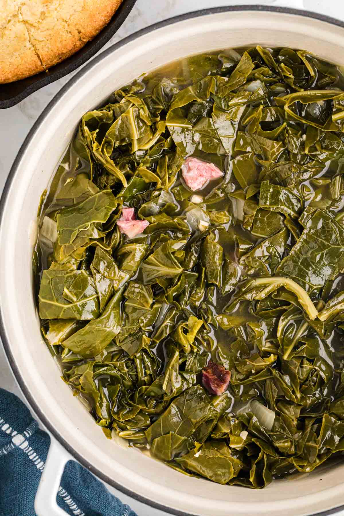 A pot of collard greens in the pot liquor juices.