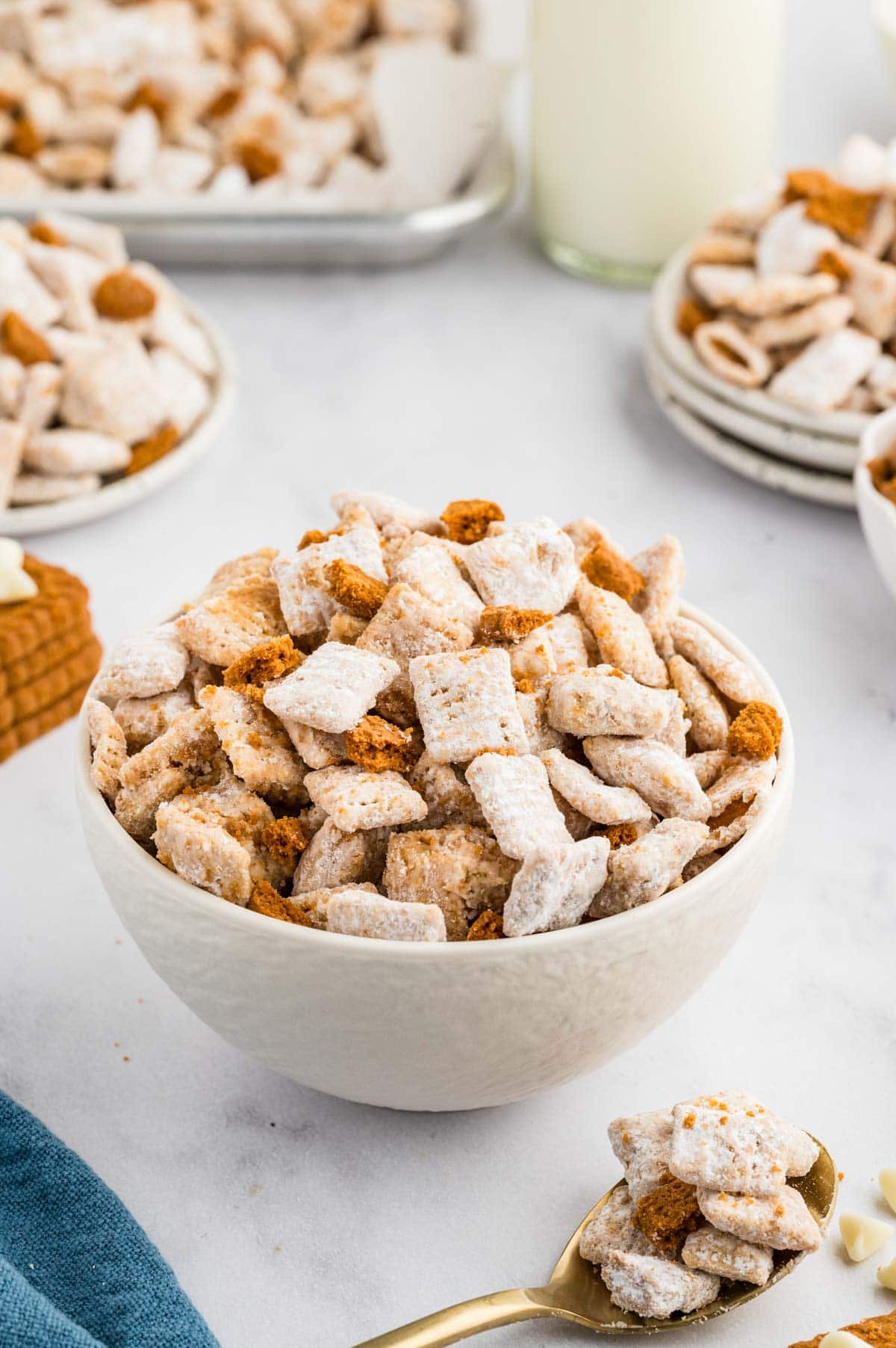 Biscoff cookie muddy buddies served in a white bowl.