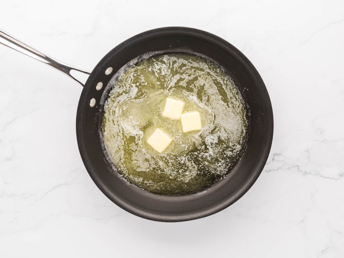 Butter melting in a skillet.