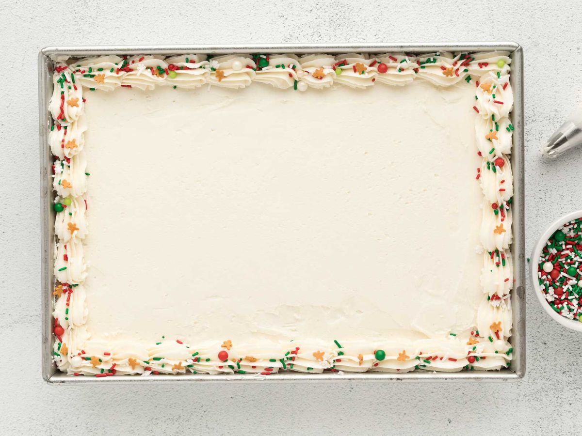 Overhead shot of gingerbread cake in a baking dish with sprinkles around the edges.