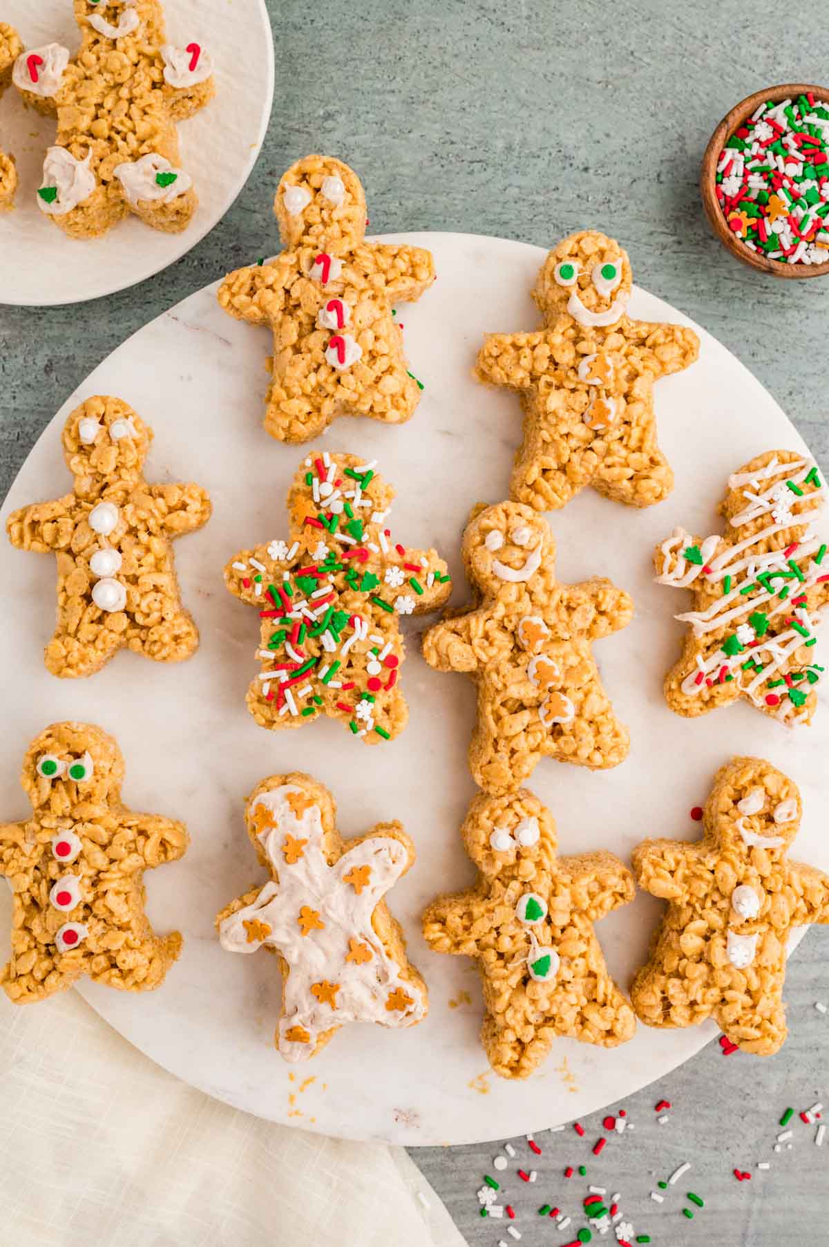 Gingerbread rice krispie treats served on a marble slab.