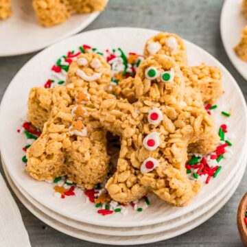 Three gingerbread rice krispie treats on a plate.