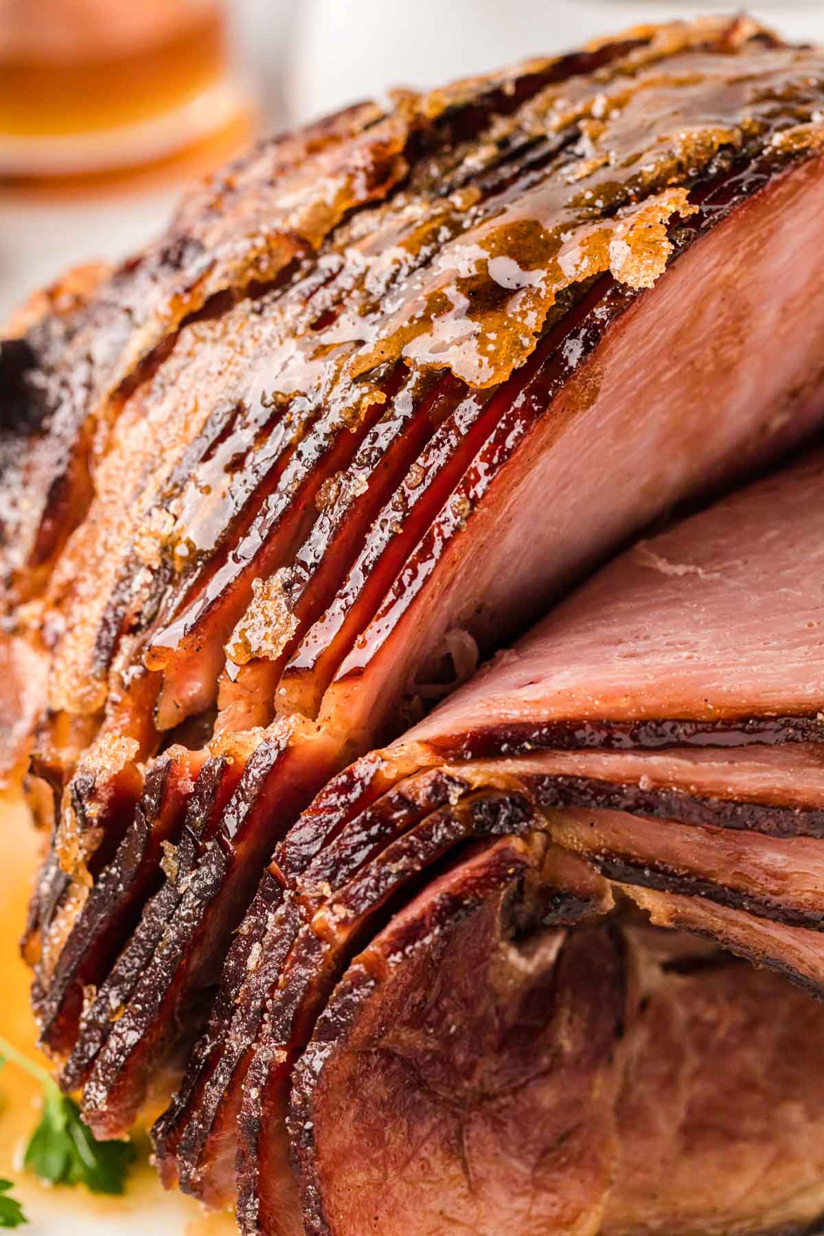 A close-up image of the spiral cuts in a ham with a caramelized sugar crust.