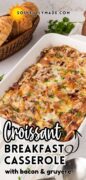 Savory Croissant Breakfast Casserole is shown in a casserole baking dish.