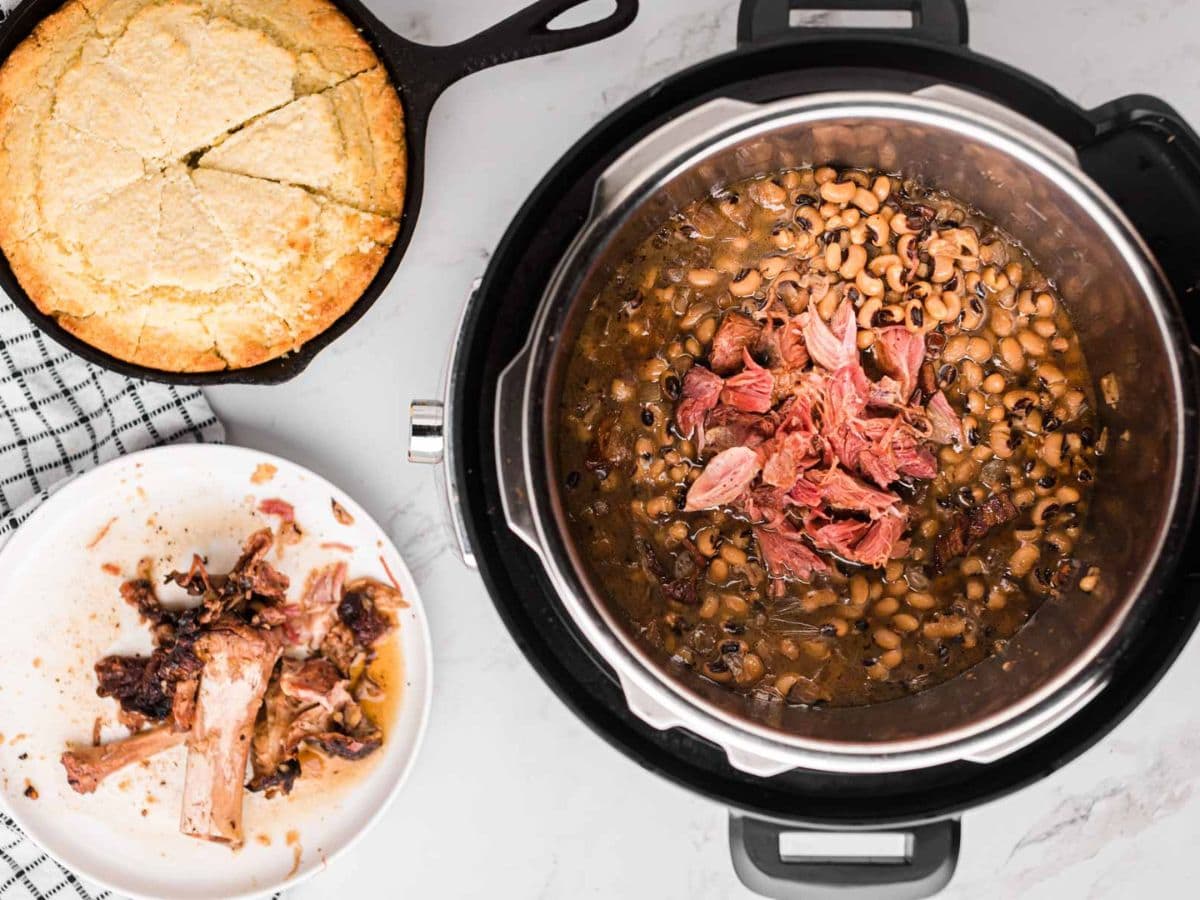 Shredded ham on top of Black Eyed Peas in the instant pot.