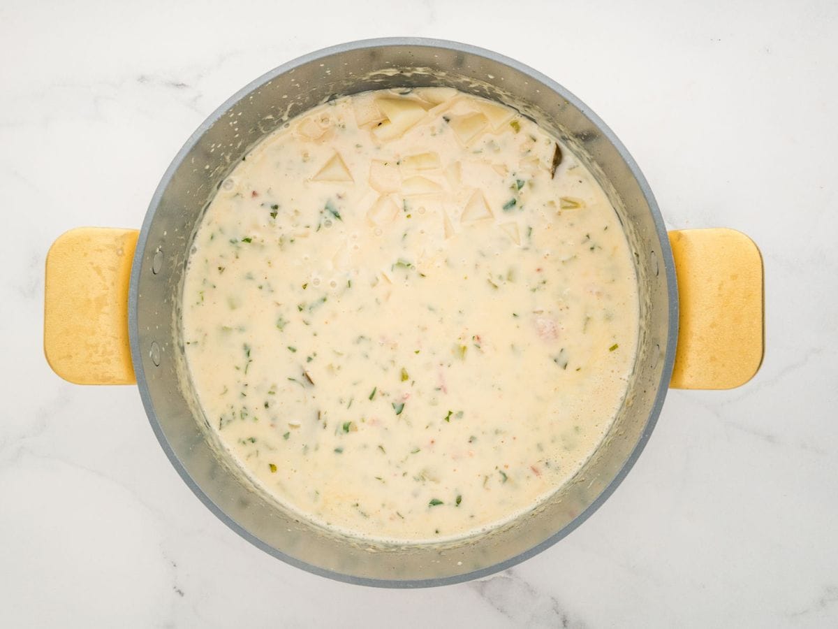 Potatoes added to the pot of soup.