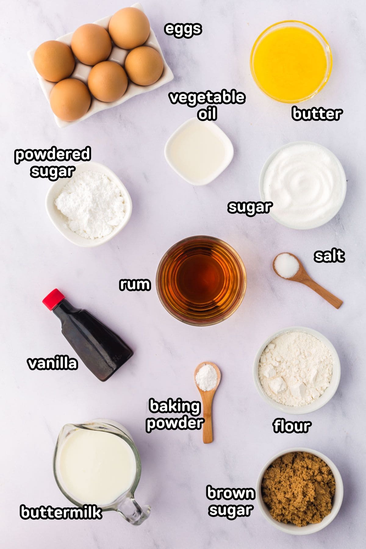 Ingredients needed to make rum cake on a counter.