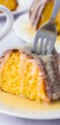 An image only pin for the Rum Cake recipe showing a golden moist slice with glaze and a fork ready to dig in.