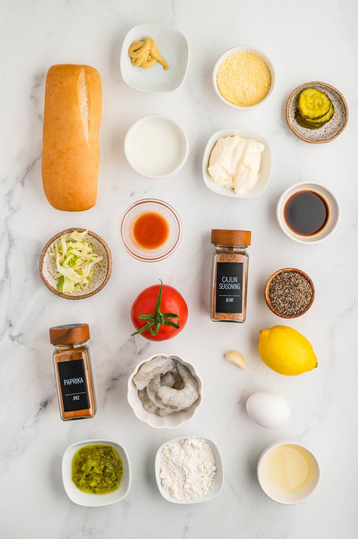 Ingredients needed to make shrimp po boy sandwiches.