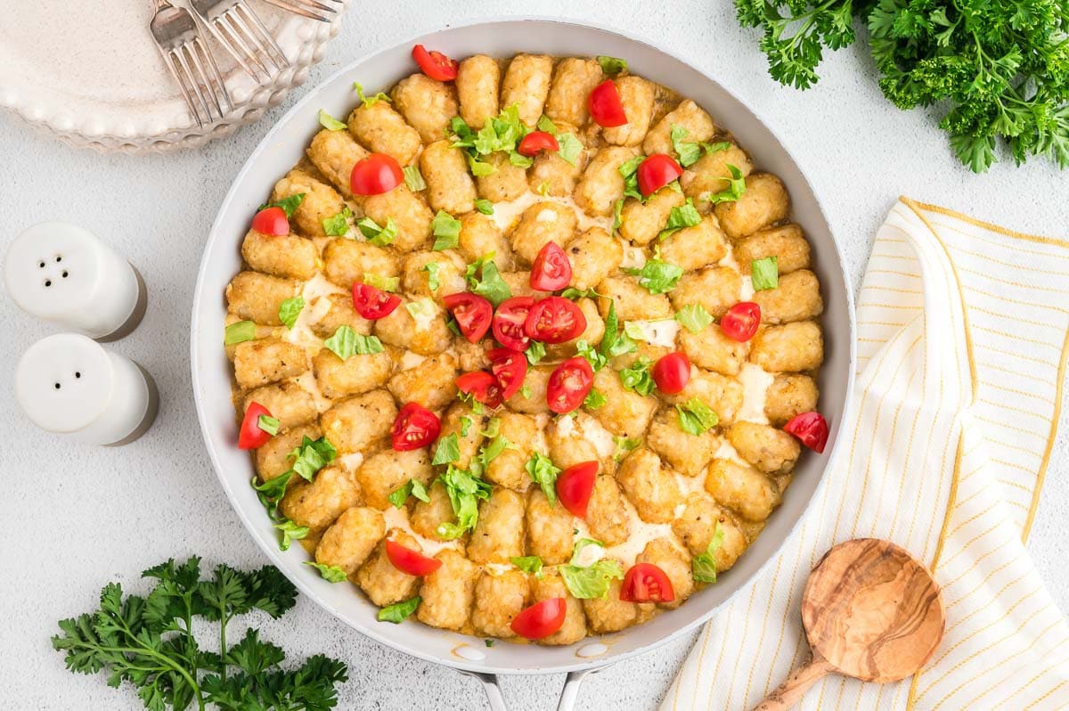 Overhead shot of the baked and garnished big mac tater tot casserole.