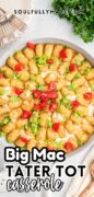 Big Mac Tater Tot Casserole is in the baking dish with the tots placed in a circle going into the center of the pan.