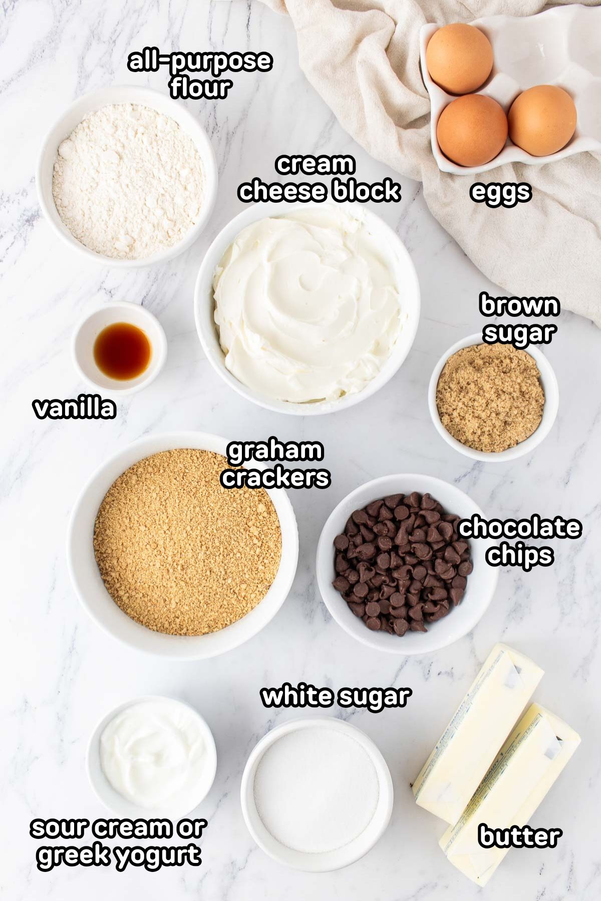 Labeled photo of the ingredients needed to make cookie dough cheesecake bars.