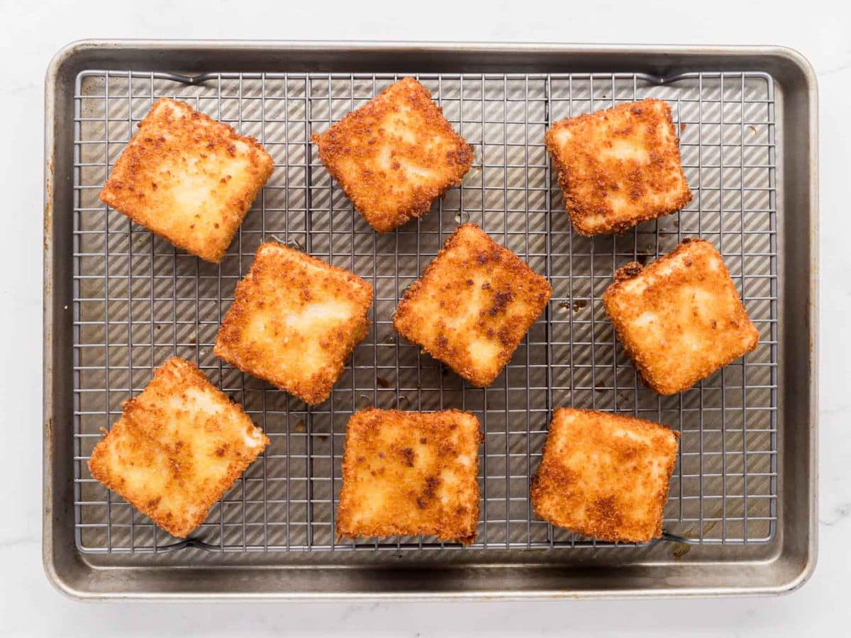 Grit cakes on a baking rack.