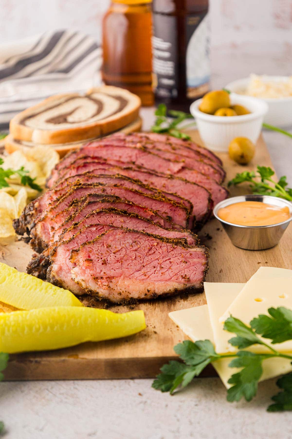 A cutting board with slice meat.