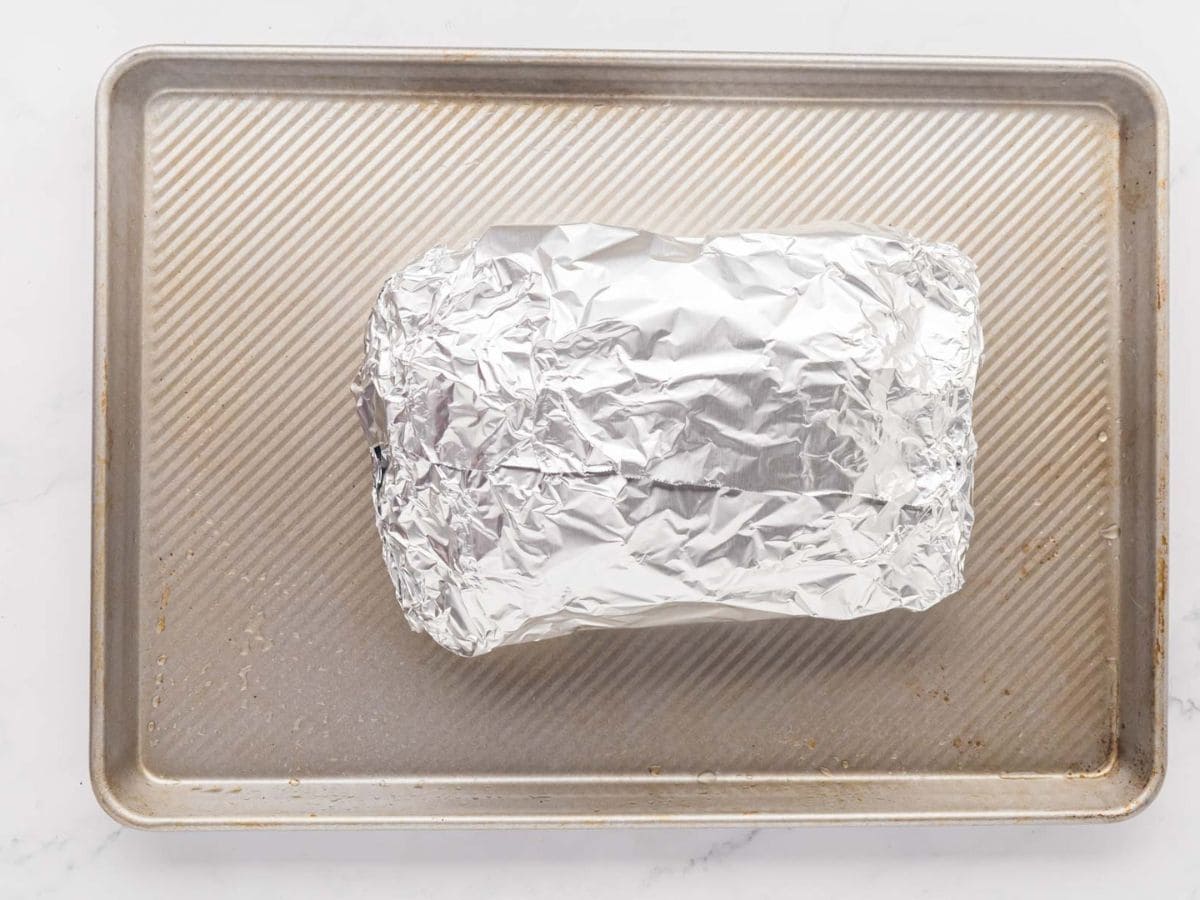 Corned beef wrapped in foil.