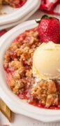 An image only pin for the Strawberry Rhubarb Crumble with a berry and icecream.