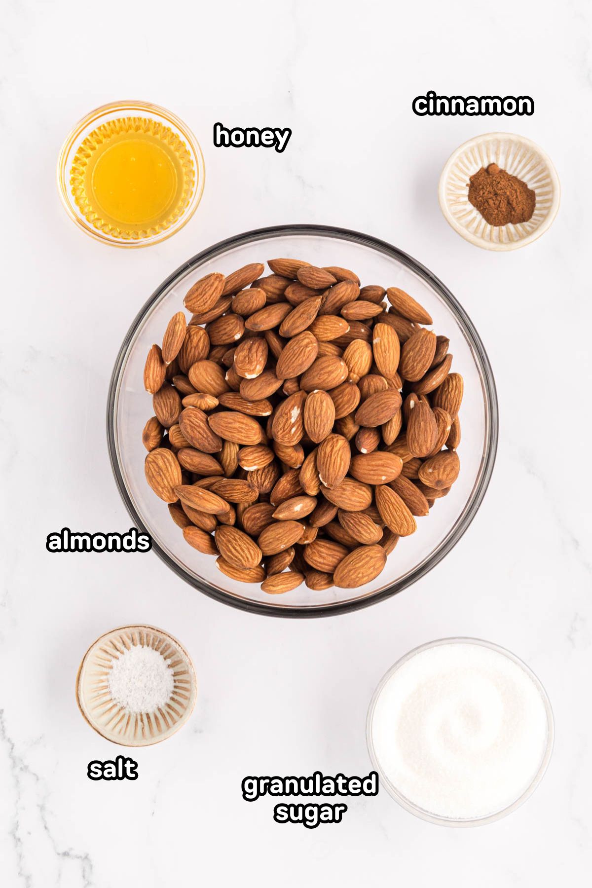 Labeled photos of ingredients needed to make honey roasted almonds.